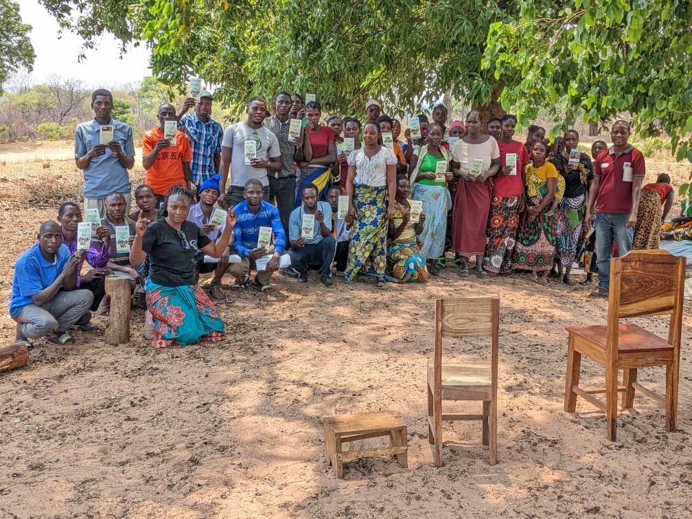 Community members gathered outdoors for a meeting